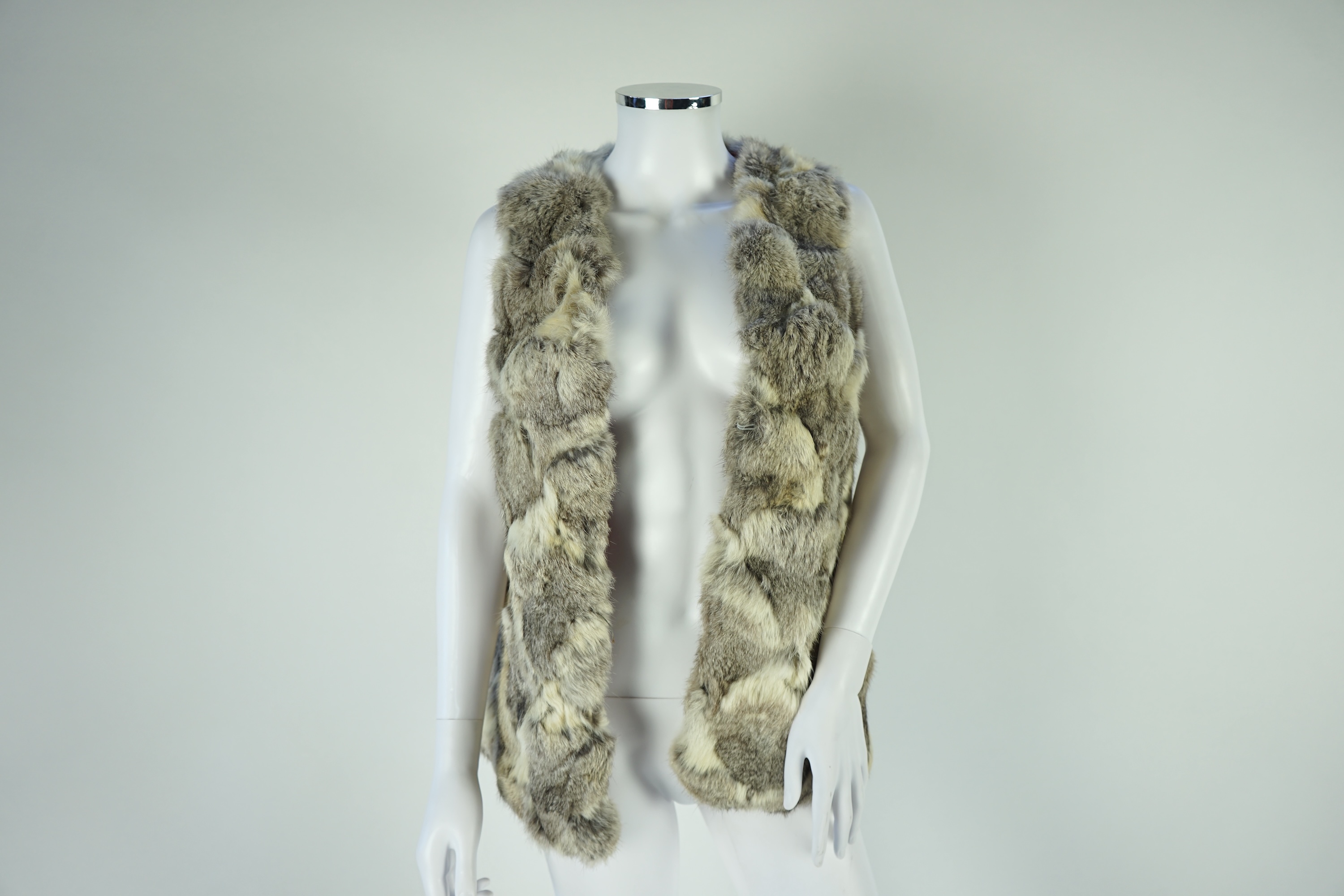 A selection of fur scarves and a fur gilet